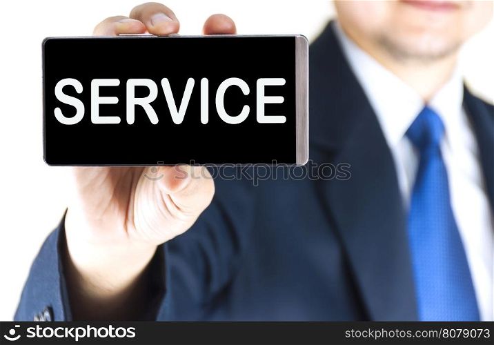 SERVICE, word on mobile phone screen in blurred young businessman hand over white background, business concept