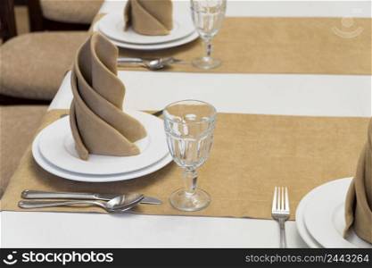serving banquet table in a luxurious restaurant in beige and white style. served table in the restaurant