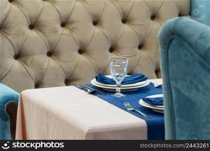 serving banquet table in a luxurious restaurant in blue and light style. served table in the restaurant