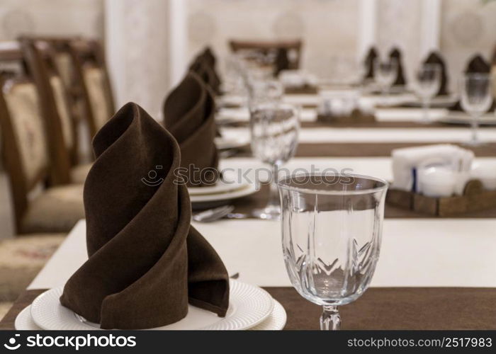 serving banquet table in a luxurious restaurant in brown and white style. served table in the restaurant