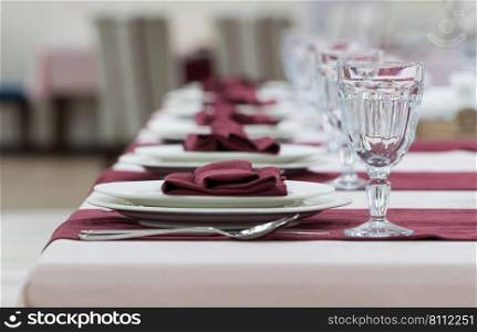 serving banquet table in a luxurious restaurant in pink and white style. served table in the restaurant