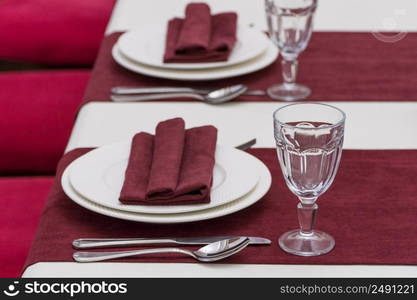 serving banquet table in a luxurious restaurant in red and white style. served table in the restaurant