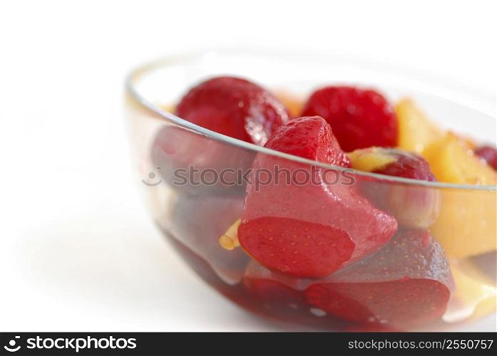 Serving of fruit salad on white background