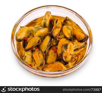 serving of pickled sea mussels in a glass bowl on a white background