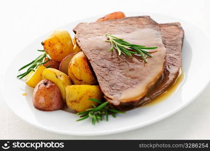 Serving of roast beef and roasted potatoes meal