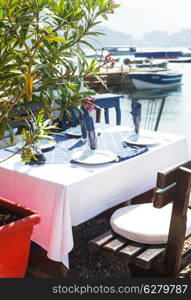 Serving table in the outdoor restaurant on the seaside