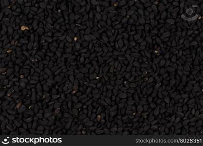 Sesame black seeds close up for background