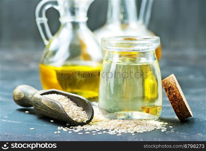 sesame oil in bottle and on a table