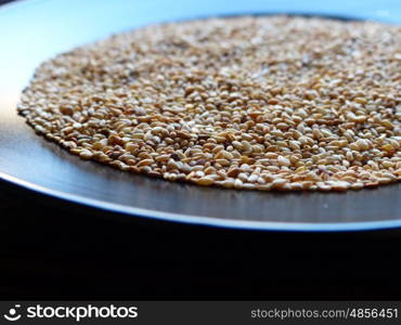 Sesame on black plate closeup&#xD;&#xA;