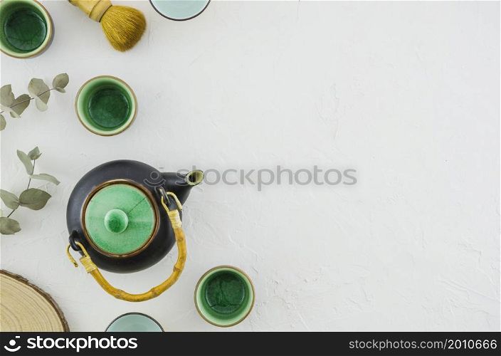 set asian herbal tea with tea brush isolated white background