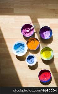 set bowls with different bright dry colors floor