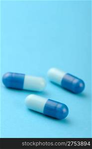 set capsules on blue background. Photo closeup