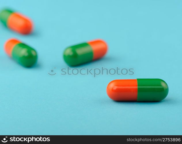 set capsules on blue background. Photo closeup