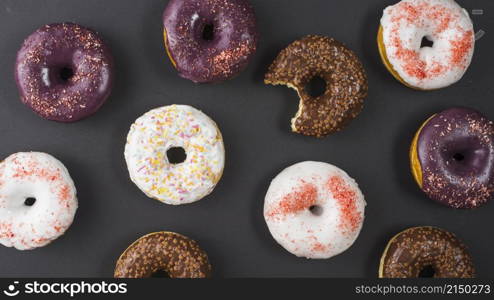 set delicious sweet bitten donuts with colorful coating