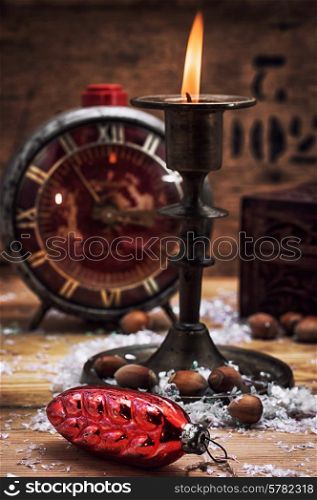 set foto burning Christmas candle in brass candlesticks