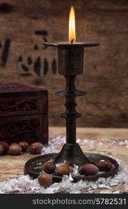 set foto burning Christmas candle in brass candlesticks