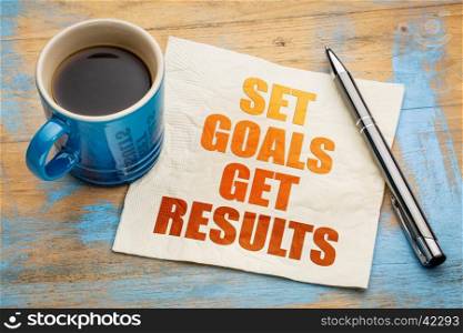 Set goals, get results - motivational word abstract on a napkin with a cup of espresso coffee