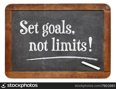 Set goals, no limits. Motivational words on a vintage slate blackboard