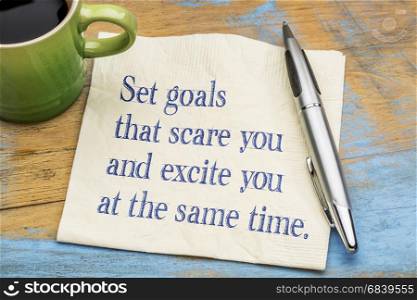 Set goals that scare and excite you at the same time - handwriting on a napkin with a cup of espresso coffee