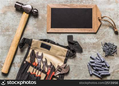 set hand tool with nails small tag slate grunge backdrop
