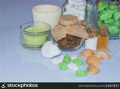 set ingredients and spice for aromatherapy and body care on a white surface with reflection. SPA still life. the attributes of aromatherapy