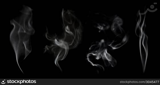 Set of abstract defocused white smoke isolated on black background