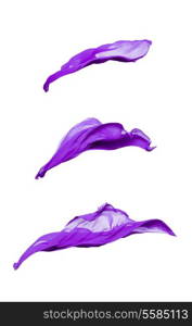 set of abstract pieces of purple fabric flying, high-speed studio shot
