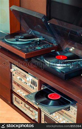 Set of audio equipment, record players, amplifiers, radio and vinyl records