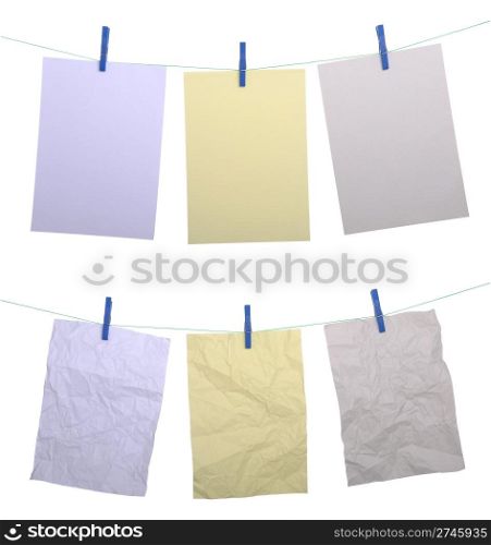 set of big paper notes hanging on wire with clothespin (isolated on white background)