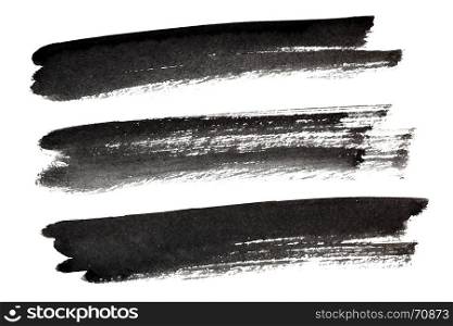 Set of black ink brush strokes isolated on the white background