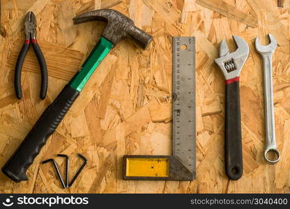 set of carpentry tools on wood background . flat lay tools worki. set of carpentry tools on wood background . flat lay tools working space for carpenter , top view