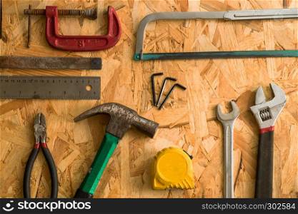 set of carpentry tools on wood background . flat lay tools working space for carpenter , top view