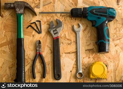set of carpentry tools on wood background . flat lay tools working space for carpenter , top view