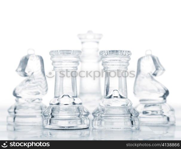 set of chess pieces are defending king, cut out from white