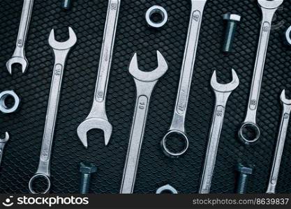 Set of chrome wrenches on steel surface. Mechanic tools for maintenance. Hardware tools to fix. Technical tools background. Set of chrome wrenches on steel surface. Mechanic tools for maintenance. Hardware tools to fix. Technical tools background with copy space