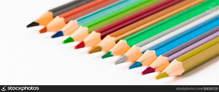 Set of colored pencils on a white background. Back to school concept. Place for text. Ban≠r format. Set of colored pencils on white background. Back to school concept. Place for text.