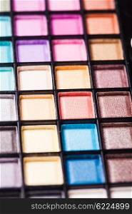 Set of colored powder with brush for make-up in a plastic case. Bright eyeshadow palette