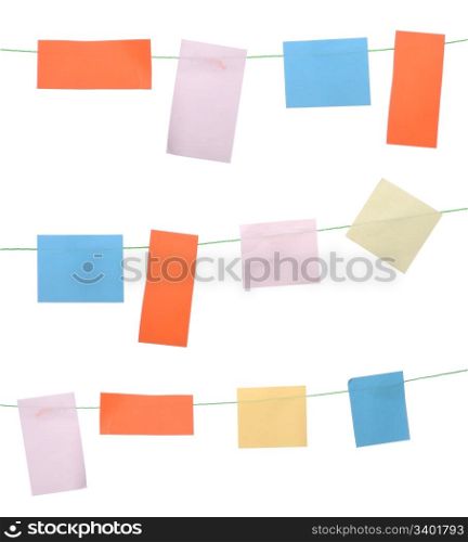 set of colored sticky notes hanging on wire (isolated on white background)