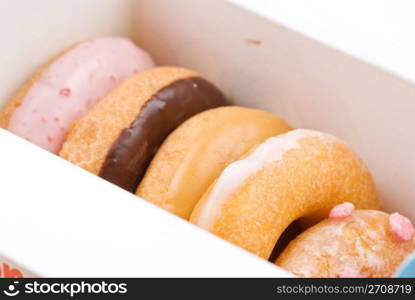 Set of colorful and delicious donut in paper box