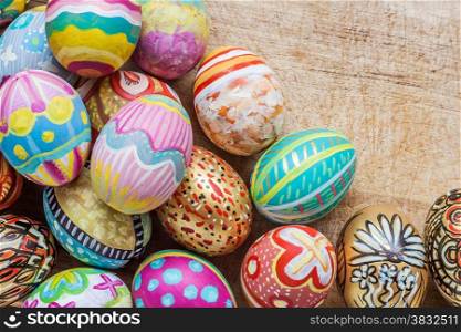 Set of colorful easter egg on wooden background with space for adding text