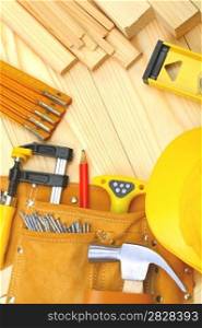 set of construction tools on wooden boards