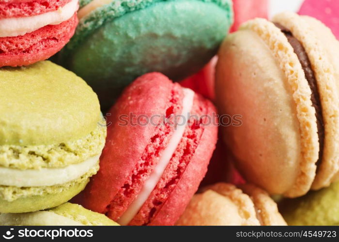 Set of delicious macaroons. Many colourful tasty macaroons in a row