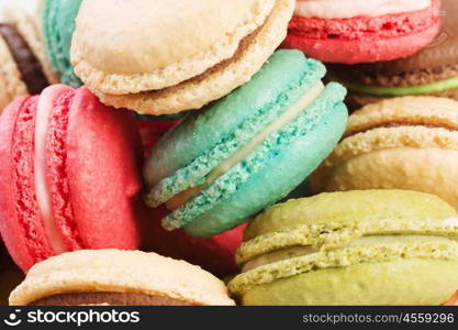 Set of delicious macaroons. Many colourful tasty macaroons in a row