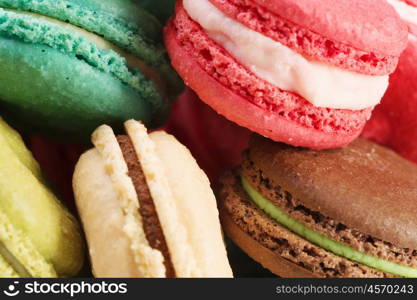 Set of delicious macaroons. Many colourful tasty macaroons in a row