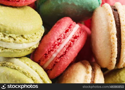 Set of delicious macaroons. Many colourful tasty macaroons in a row