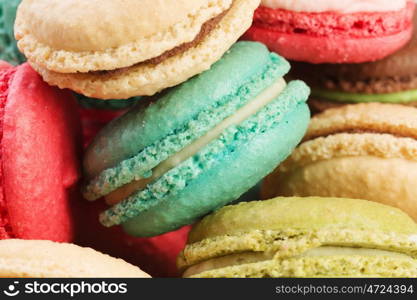 Set of delicious macaroons. Many colourful tasty macaroons in a row