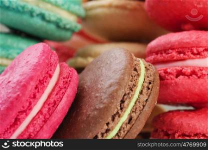 Set of delicious macaroons. Many colourful tasty macaroons in a row