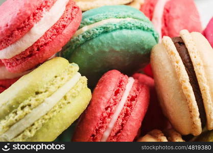 Set of delicious macaroons. Many colourful tasty macaroons in a row