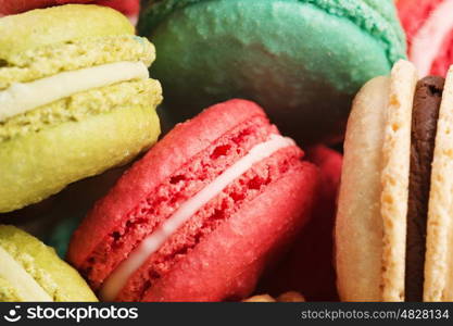 Set of delicious macaroons. Many colourful tasty macaroons in a row