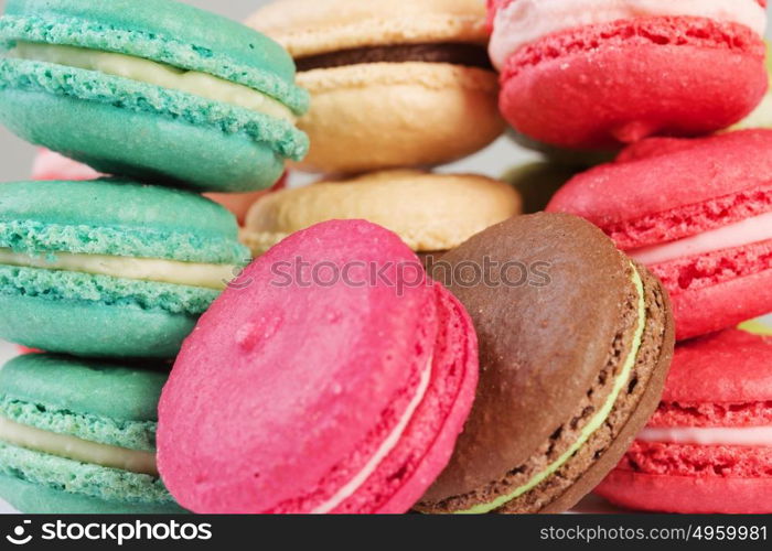 Set of delicious macaroons. Many colourful tasty macaroons in a row